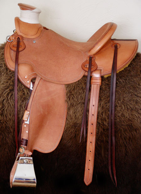 Cowgirl Cate light weight Wade with Orchid Floral tooling.  Contact us about a saddle made just for you like this one.